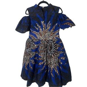 Handmade African fit and flare dress with rhinestone detail and should cut outs